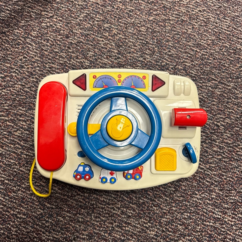 Vintage Interactive Steering Wheel Toy with Red and Blue Accents sounds/lights